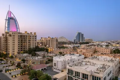 a view of a city with a tall building at Premium 1BR with Iconic Skyline Views with Balcony & Pool in Dubai