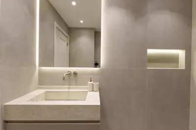 a bathroom with a sink and a mirror at Daniels 2BR at Princess Tower with Sea View in Dubai