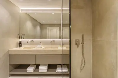 a bathroom with a sink and a mirror at Daniels 1BR at Shoreline with Sea View in Dubai