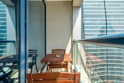 a table and chairs on the balcony of a building at GuestReady - Modern urban retreat in JLT in Dubai