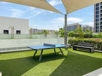 a ping pong table on the roof of a building at Stunning Luxury Studio in Dubai in Dubai