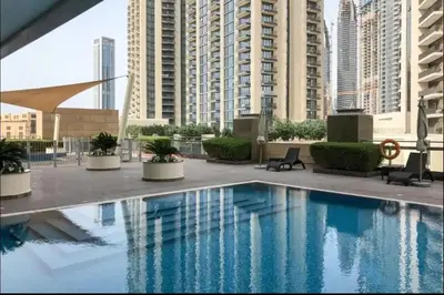 a swimming pool in a building with tall buildings at AWS Holiday Homes - Style in Downtown in Dubai