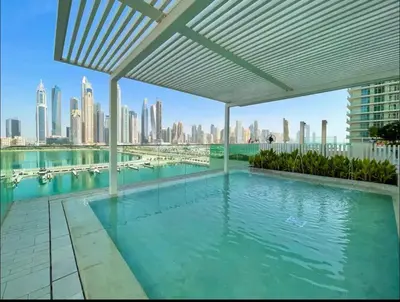 a swimming pool with a view of the city at AWS Holiday Homes - Amazing Beachfront Stay in Dubai