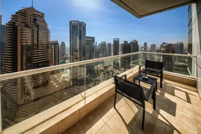 a balcony with a view of a city skyline at Elegant 1 Bedroom in Botanica Tower Marina in Dubai