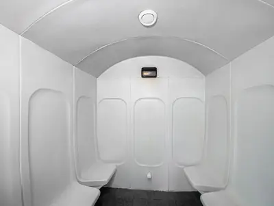 a bathroom with three toilets in a white wall at Elegant 1 Bedroom in Botanica Tower Marina in Dubai