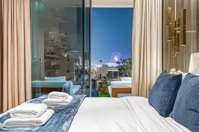 a bedroom with a bed and a view of the city at FIVE Palm Jumeirah Premier Apartments in Dubai
