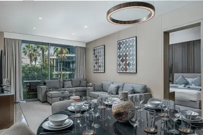 a living room with a table and a couch at FIVE Palm Jumeirah Premier Apartments in Dubai