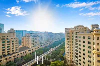 a view of a city with tall buildings at LUX The Palm Island Shoreline Suite in Dubai