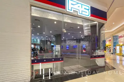 a store with a large glass window in a shopping mall at LUX The Palm Island Shoreline Suite in Dubai