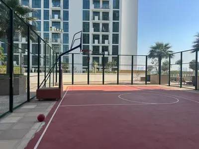 a basketball court in a city with a building at Studio Free Parking Pet Friendly Near Downtown Dubai in Dubai
