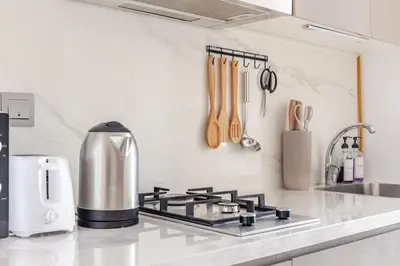 a kitchen counter top with a stove top oven at Studio Free Parking Pet Friendly Near Downtown Dubai in Dubai