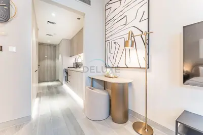 a kitchen with a small table in a room at Pool View Studio with Balcony Close to Mall, Concept 7 Residences, Jumeirah Village Circle by Deluxe Holiday Homes in Dubai