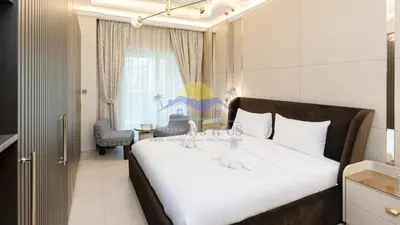 a bedroom with a large white bed in a room at Holidays R Us villa 4 bedroom boulevard view in Dubai
