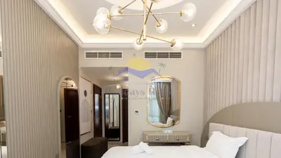 a bedroom with a bed and a large mirror at Holidays R Us villa 4 bedroom boulevard view in Dubai