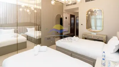 a bedroom with two beds and a mirror at Holidays R Us villa 4 bedroom boulevard view in Dubai