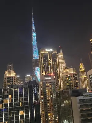 a view of a city skyline at night at Stylish 2BR Apt in Business Bay Burj & Creek Views in Dubai