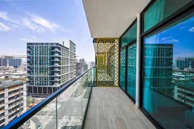 a balcony with a view of a city at Stunning 1 Bdr luxury residence at JVC in Dubai