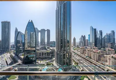 a view of a city skyline with tall buildings at Luxurious Studio with Burj Khalifa View Direct Dubai Mall Access - Kempinski Residence in Dubai