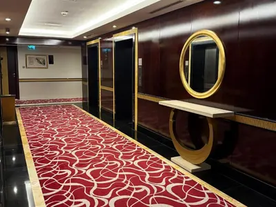 a dressing room with a red carpet and a mirror at Stylish 1BR, 2Min to Dubai Mall in Dubai