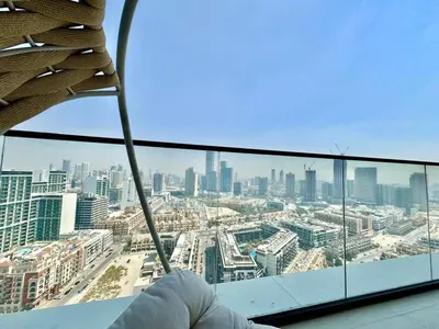 a view of a city from the top of a building at Elegant 2br Jvc Private Pool, Balcony & Parking in Dubai