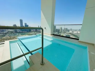 a swimming pool on the top of a building at Elegant 2br Jvc Private Pool, Balcony & Parking in Dubai