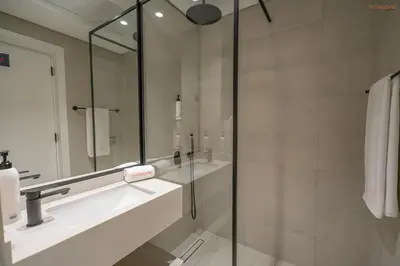 a bathroom with a sink and a mirror at Bnbeyond's Sassy Studio with Expansive Balcony in Dubai