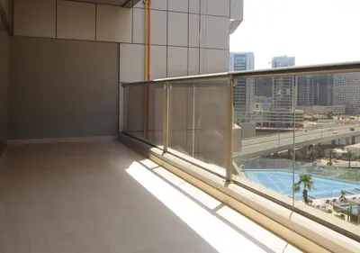 an empty room with a view of a pool in a building at Elegant 2BR with City Views Downtown Dubai Living in Dubai