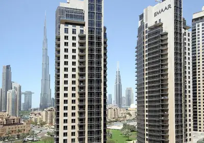 a view of two tall buildings in a city at Elegant 2BR with City Views Downtown Dubai Living in Dubai