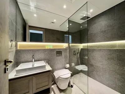 a bathroom with a toilet and a sink and a shower at Prime Studio in the Heart of JVC-Dubai in Dubai