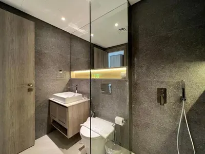a bathroom with a toilet and a sink and a shower at Prime Studio in the Heart of JVC-Dubai in Dubai