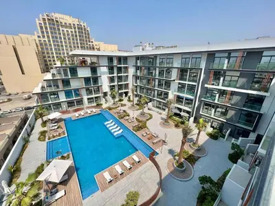 an aerial view of a hotel with a swimming pool at Prime Studio in the Heart of JVC-Dubai in Dubai
