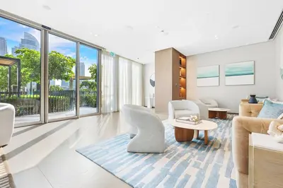 a living room with white furniture and large windows at FIRST CLASS 2BR Luxurious Downtown Bliss in Dubai