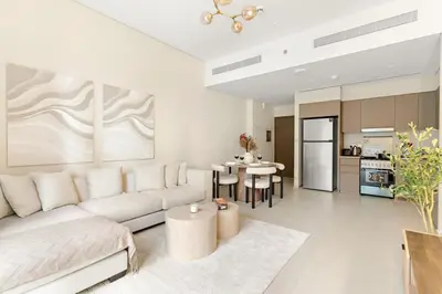 a living room with a couch and a table at FIRST CLASS 2BR Luxurious Downtown Bliss in Dubai
