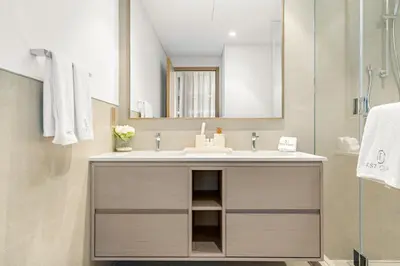 a bathroom with a sink and a mirror at FIRST CLASS 2BR Luxurious Downtown Bliss in Dubai