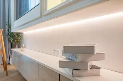 a bunch of boxes sitting on a counter in a room at Vacationer I Luxe Studio I Steps to Burj Khalifa & Dubai Mall I Free Parking, Pool, Gym & Wi-Fi in Dubai