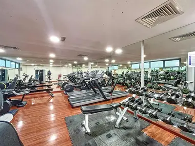 a gym filled with lots of treadmills and machines at Azure Residence - Magnificent Three Bed in Marina in Dubai