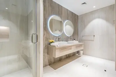 a bathroom with a sink and a mirror at Near the Beach 4BR Villa with Assistant's Room, Minutes Away from the Mall and Monorail, Canal Cove, Palm Jumeirah by Deluxe Holiday Homes in Dubai