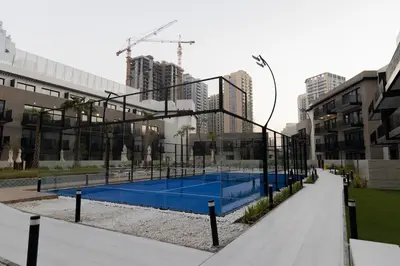 a tennis court in the middle of a city at Luxurious 2BR in Oakley Square Residence, JVC in Dubai