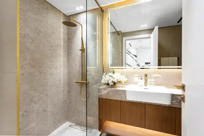 a bathroom with a sink and a shower at Exclusive 1 Bedroom in Trillionaire Residences in Dubai