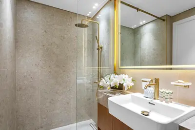 a bathroom with a sink and a shower at Exclusive 1 Bedroom in Trillionaire Residences in Dubai