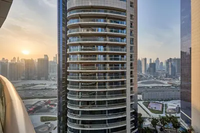 a view of a tall building in a city at Spacious 2 Bedroom Apartment in DAMAC Towers by Paramount Dubai with Pool Gym Free Parking Sleeps 4 by Stayfinity in Dubai