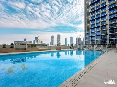 a large swimming pool on the roof of a building at GOLDEN NUMBER by Design Studio in Dubai