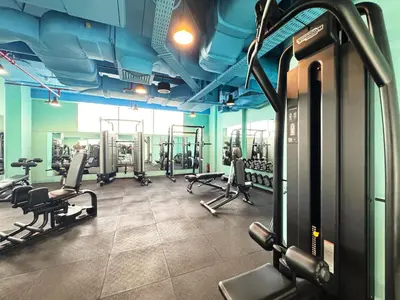 a gym with several treadmills and machines in it at Sleek DIFC Studio Perfect for Business & Leisure in Dubai