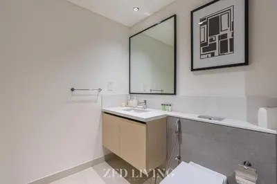 a bathroom with a sink and a mirror at Burj Crown - Spectacular 2 BR next to Burj Khalifa - Zed Living in Dubai