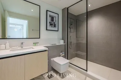 a bathroom with a shower and a toilet and a sink at Burj Crown - Spectacular 2 BR next to Burj Khalifa - Zed Living in Dubai