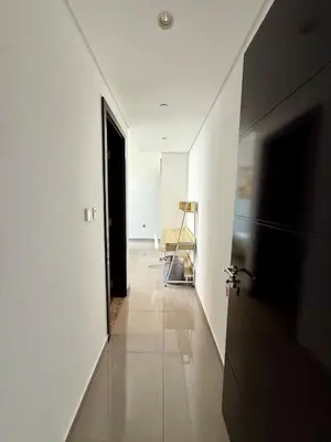 a hallway with white walls and a black door at Damac MERANO LUX 2 bedroom 3 baths in Dubai