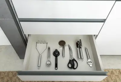 a drawer with a bunch of scissors and other tools at New 1BR with Walk-in Wardrobe in Greenish Community in Dubai