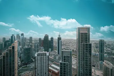 an aerial view of a city with tall buildings at Great View from 63th Floor! Amazing Pool with Burj View! Grande Signature! in Dubai