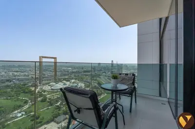 a balcony with a table and chairs in a building at Vogue Al Wasl 1 Residences Near Zabeel Park and World Trade Centre, Two Bedroom Apartment with Balcony and Dubai Frame, Access to all Amenities, Walkable to Max Fashion Metro Station in Dubai