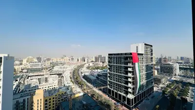 an aerial view of a city with tall buildings at Premium 1 Bed Apartment In Binghatti Venus in Dubai